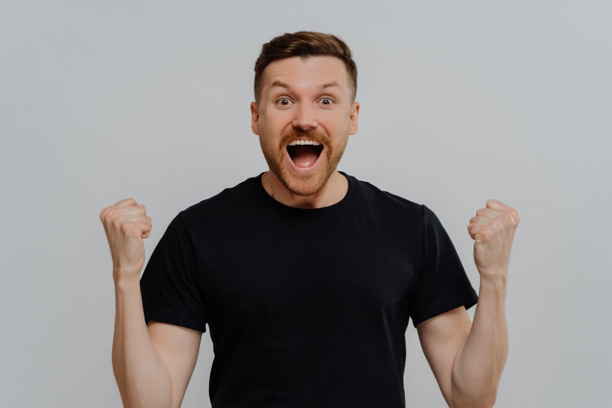 Image of a man cheering.