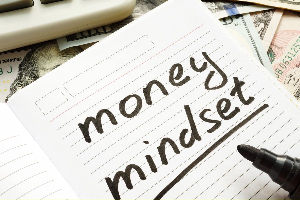 Photo of a notebook with money mindset wording.