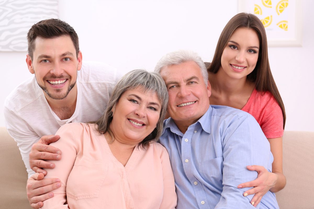 The image shows aging parents and their children.