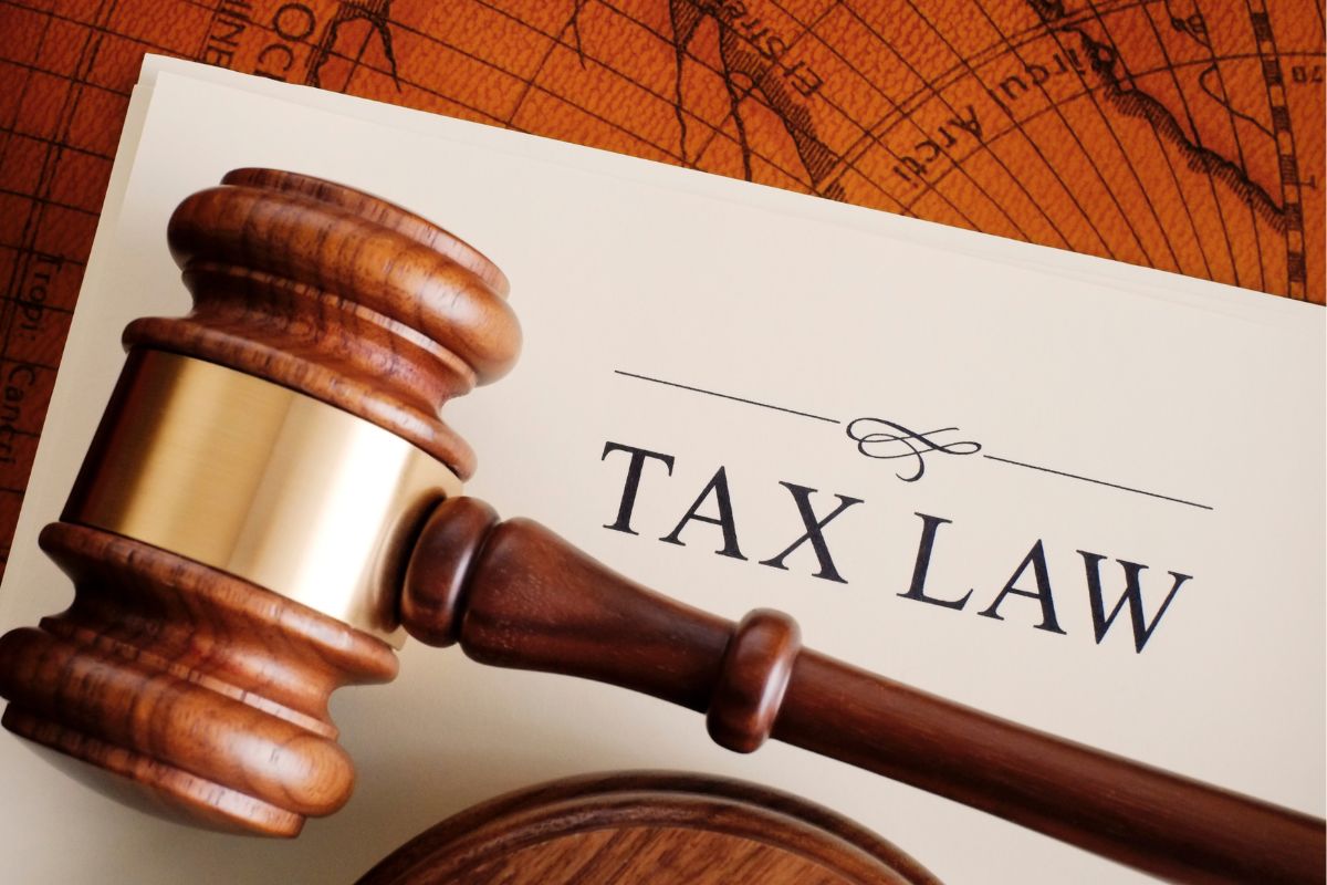 Image of a gavel and a tax law wording.