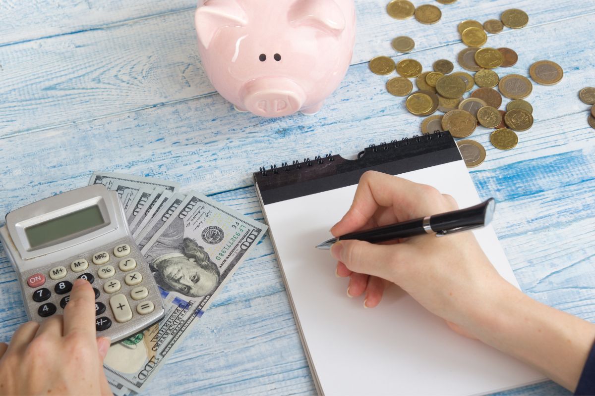 Photo of a woman's hand budgeting.