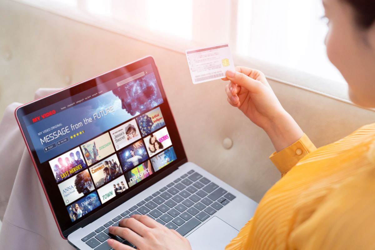 Photo of a woman using subscriptions.