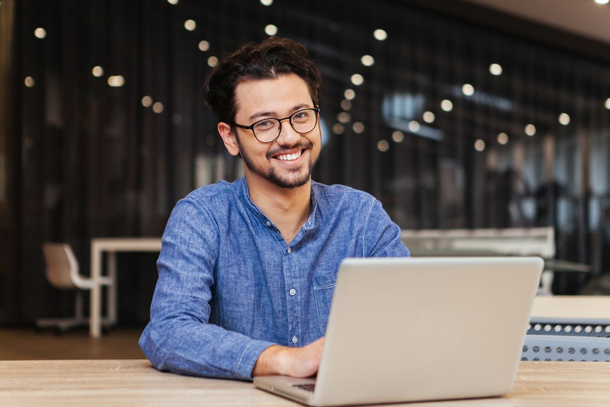 Image of a man using a laptop.