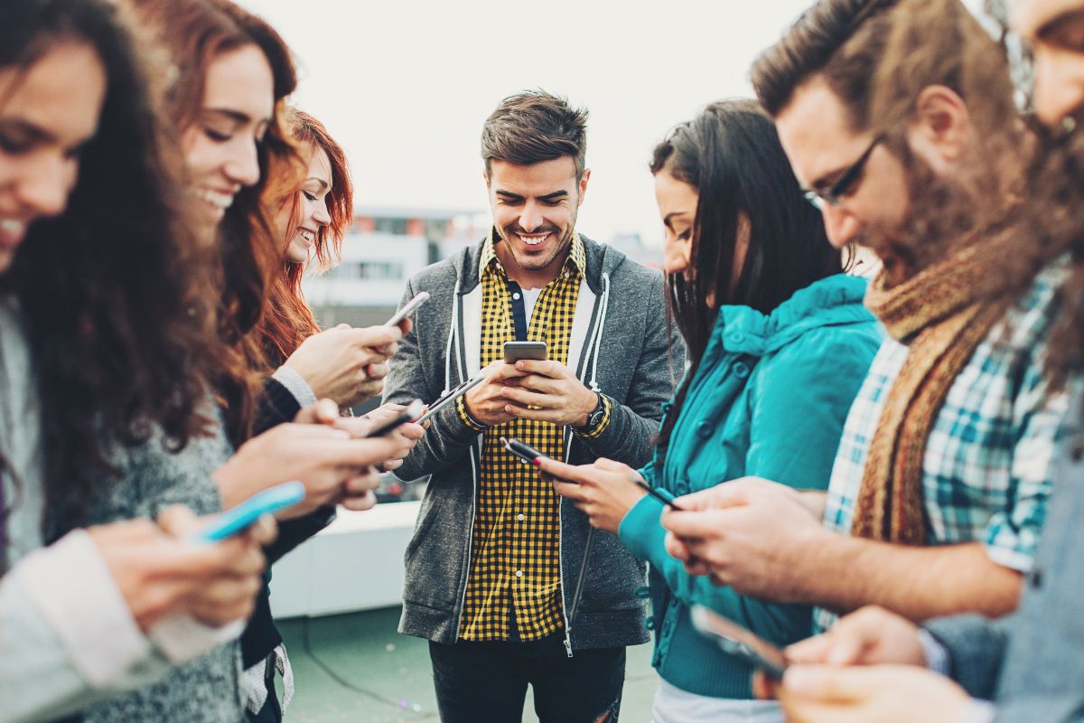 Picture of people using phones for networking.