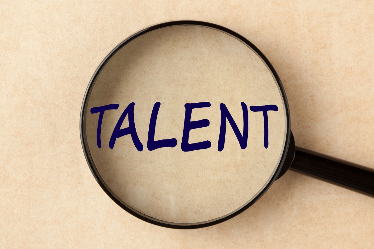 Picture of a magnifying glass with talent wording.