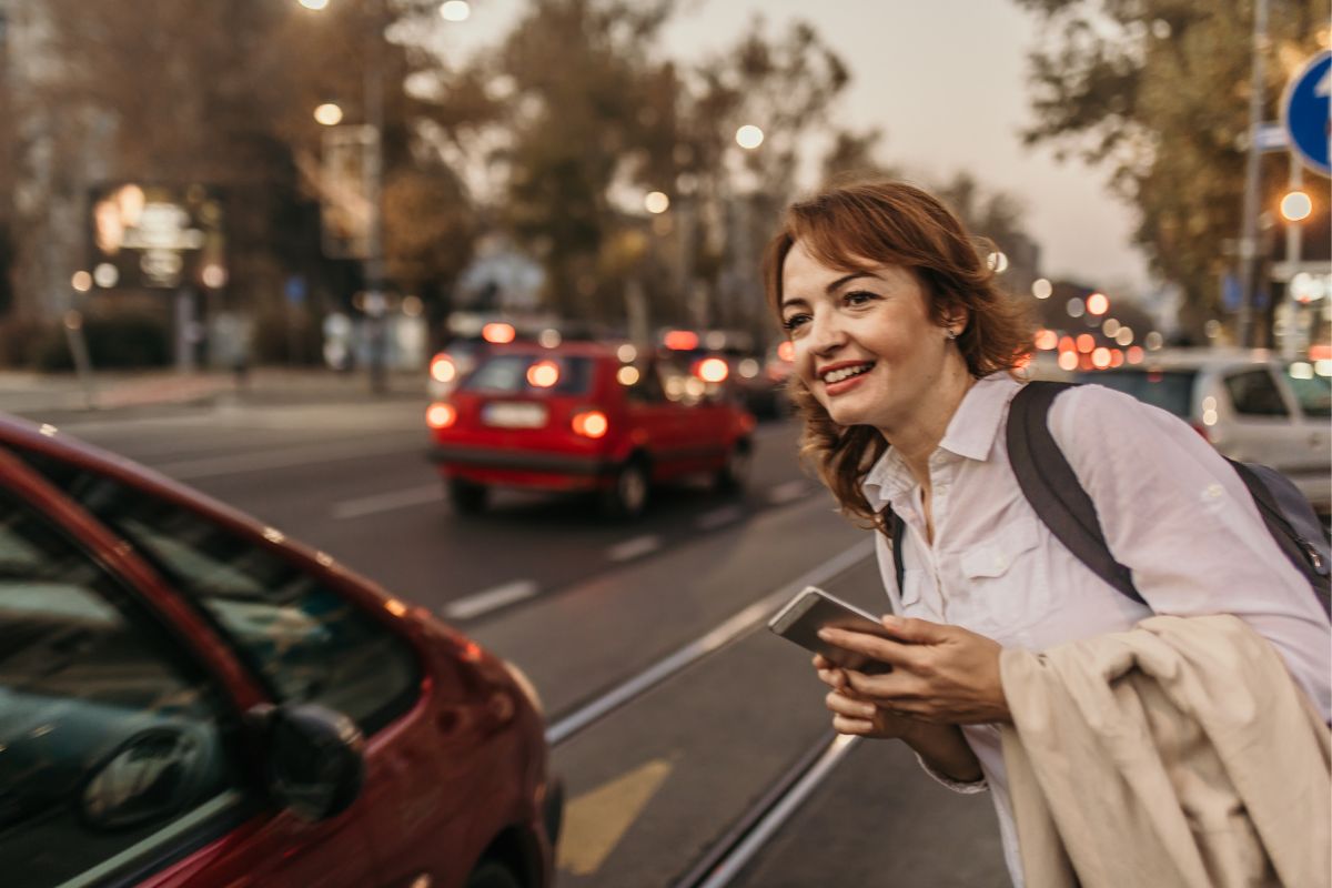 Photo of a woman waiting for transportation.