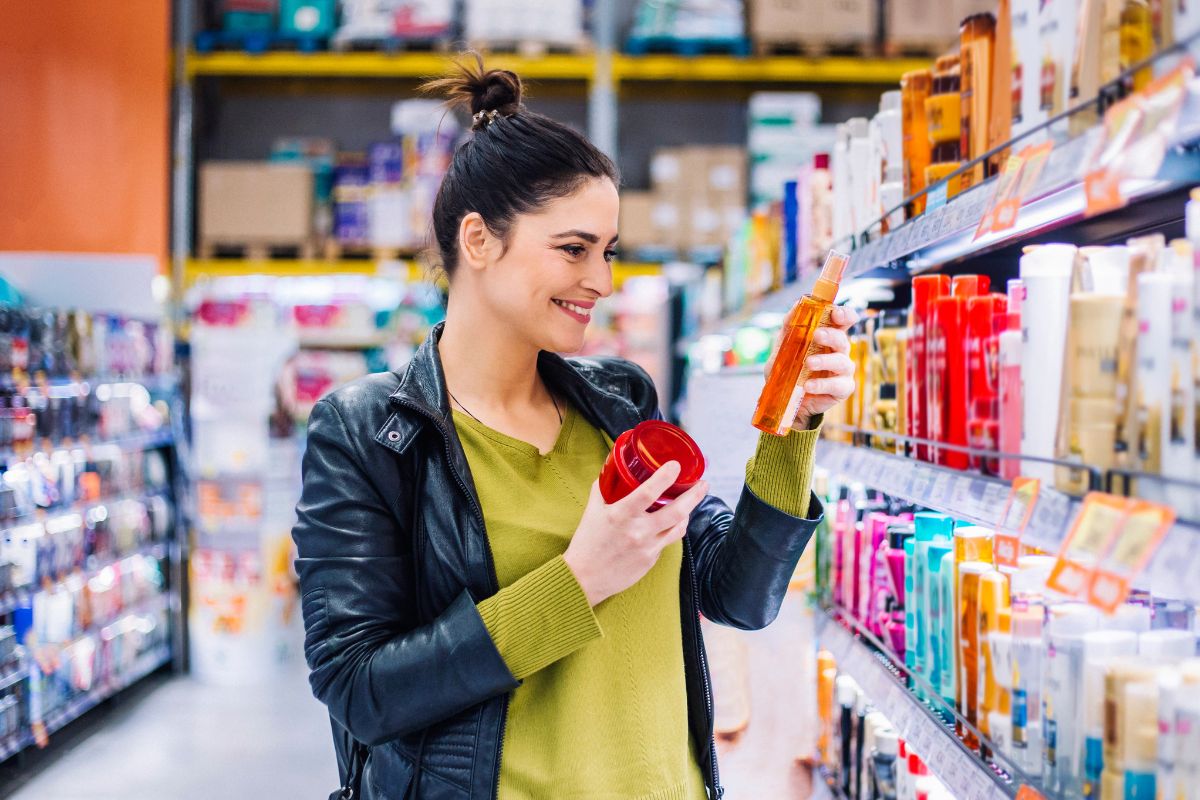 Picture of a woman comparing the products.