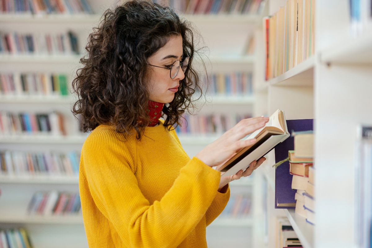 Picture of a woman reading a book.