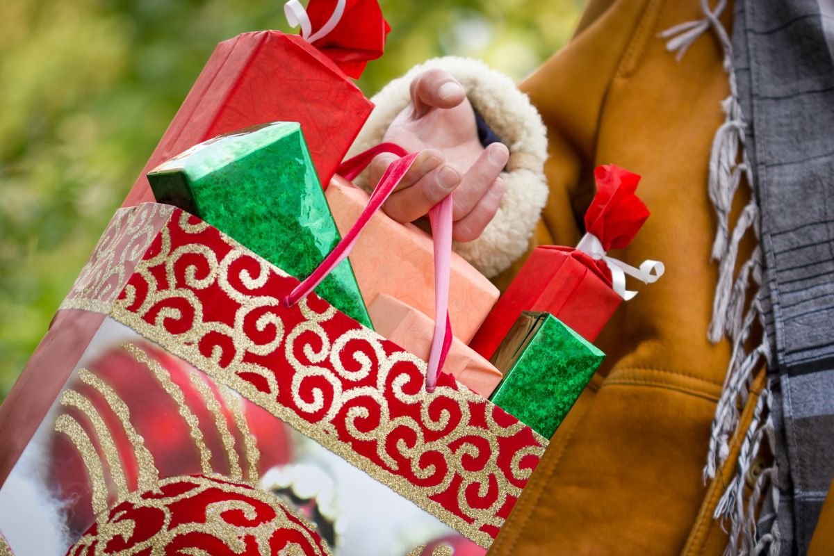 A woman's hand shopping gifts.