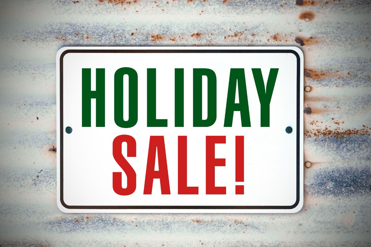 The image shows a holiday sale signage.