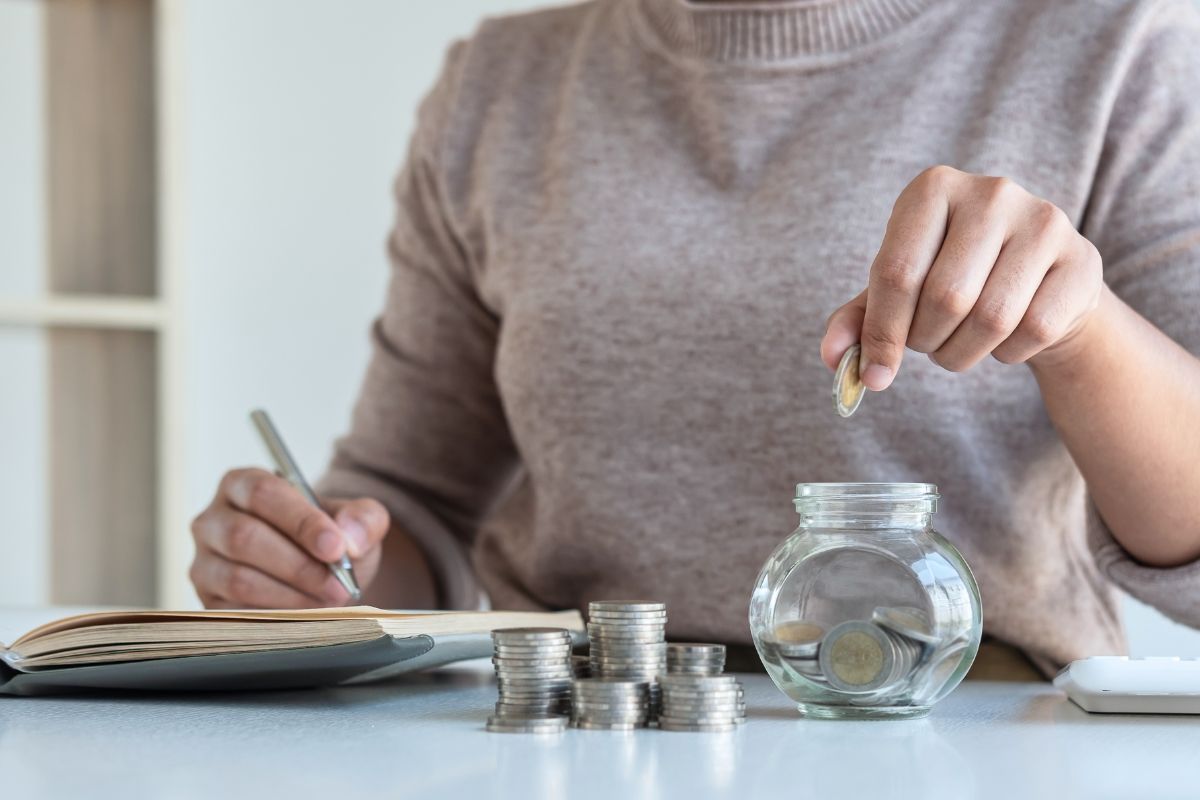 Photo of a woman saving money.