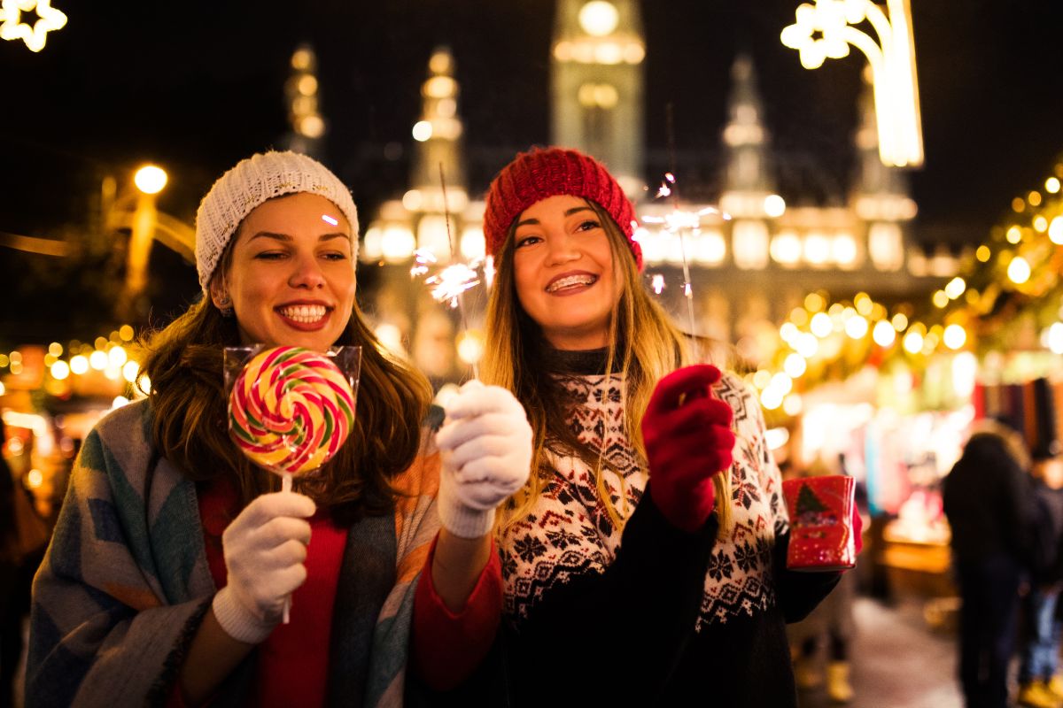 Photo of women celebrating Christmas outside.