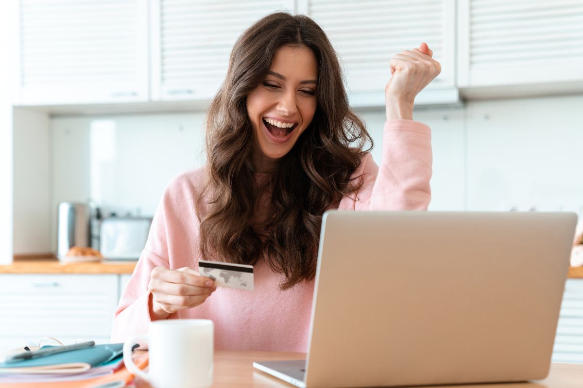 The picture shows a woman with an approved credit card.