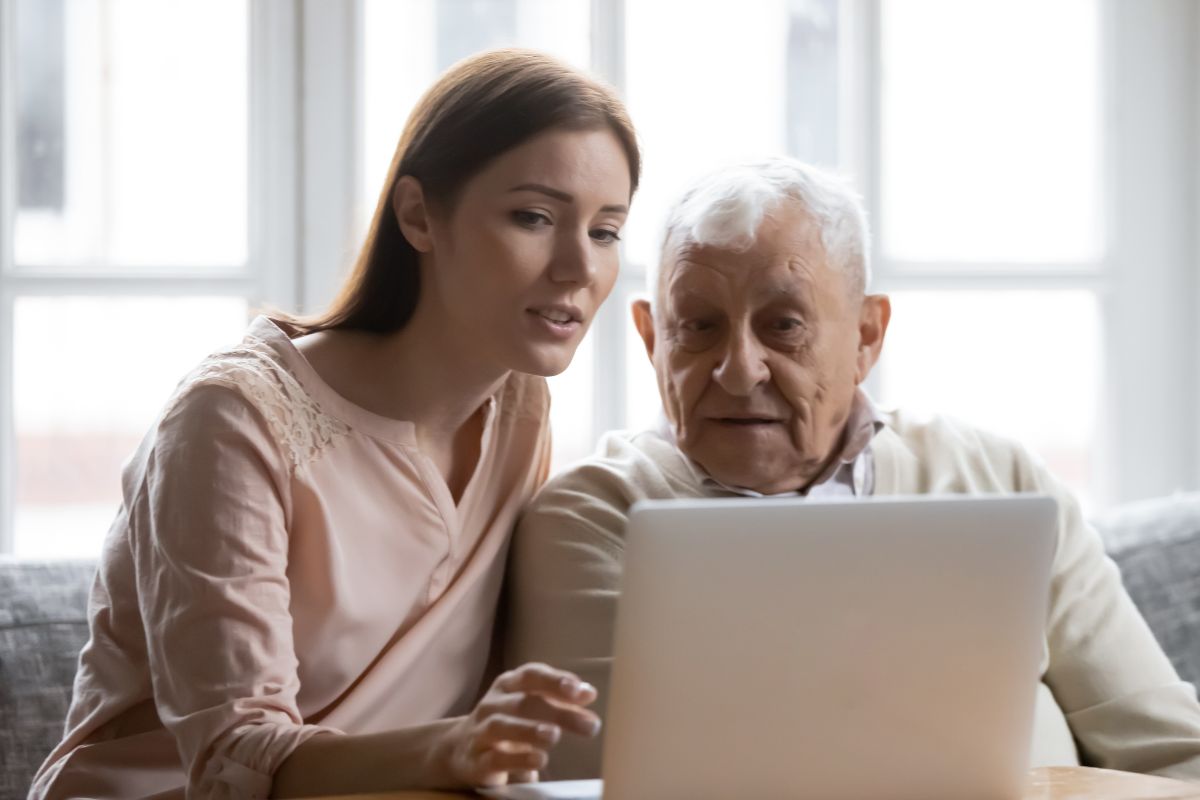 A daughter teaching her aging father about links.