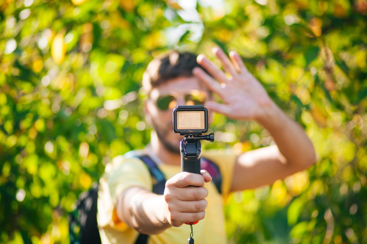Picture of a man filming himself.