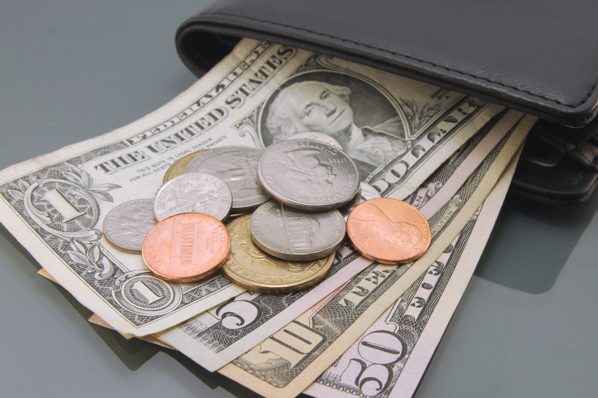 The photo shows a wallet with money.