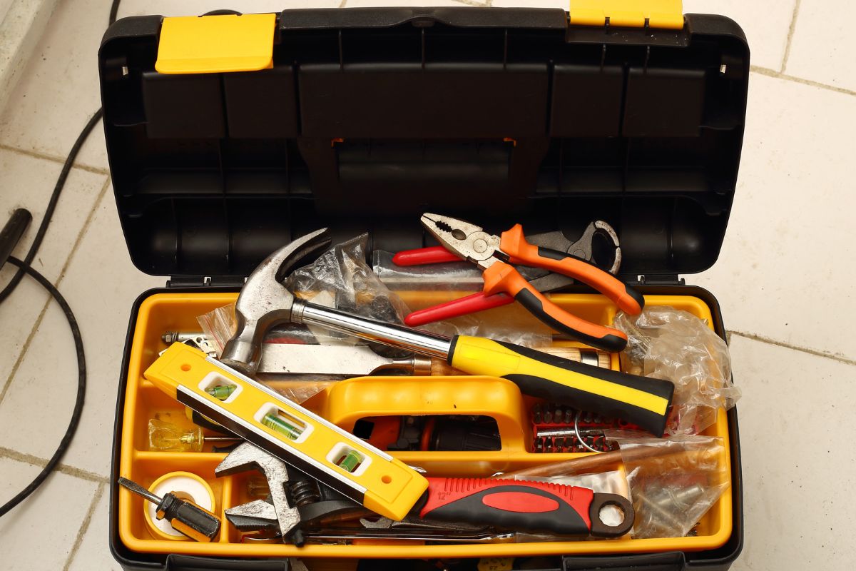 The photo shows a box of tools.