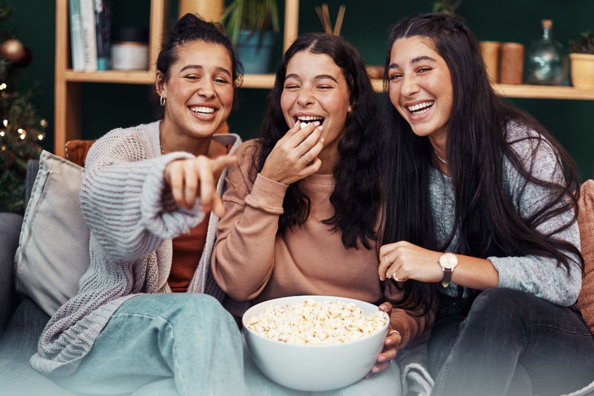 Picture shows woman eating popcorns.