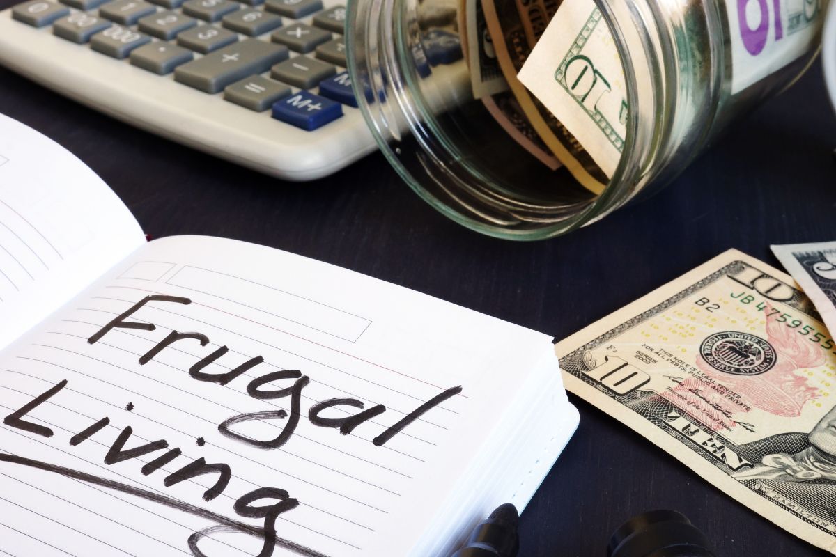 Picture of a notebook with frugal living wording.