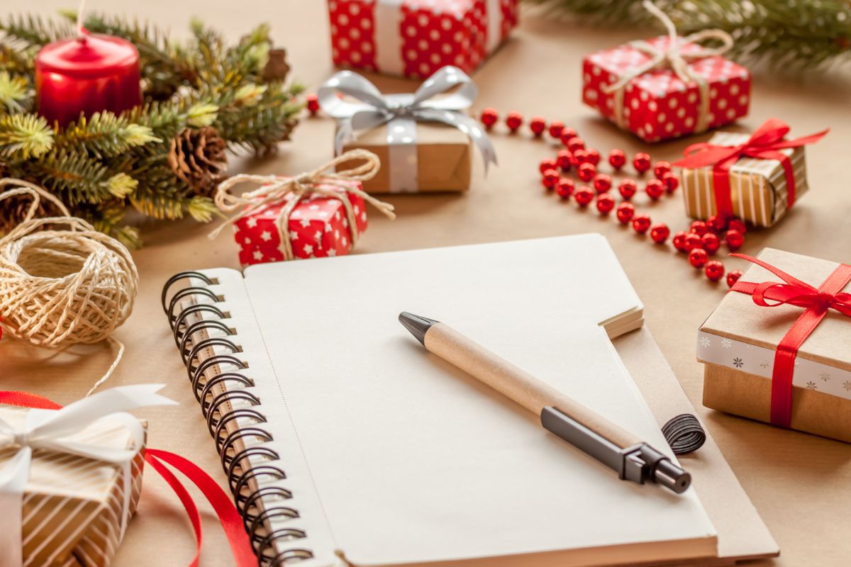 The photo shows a notebook and a pen.