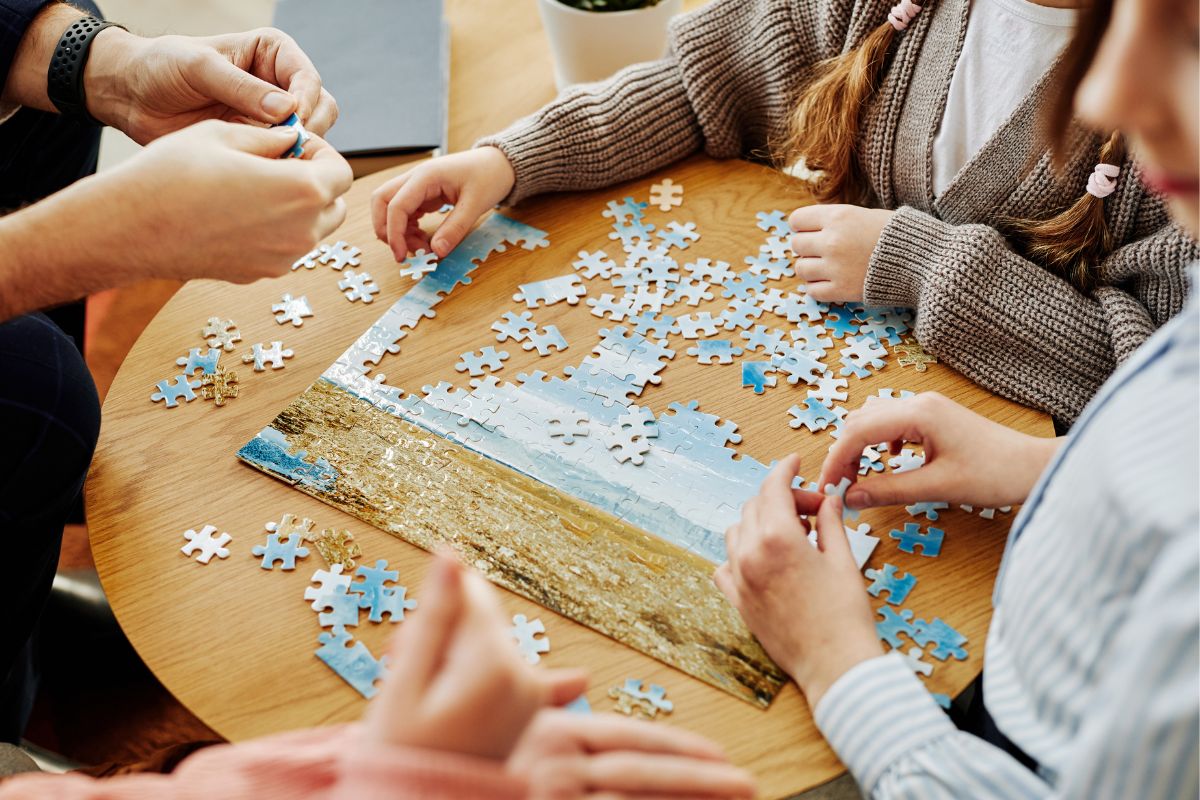 Picture of a family playing puzzle together.