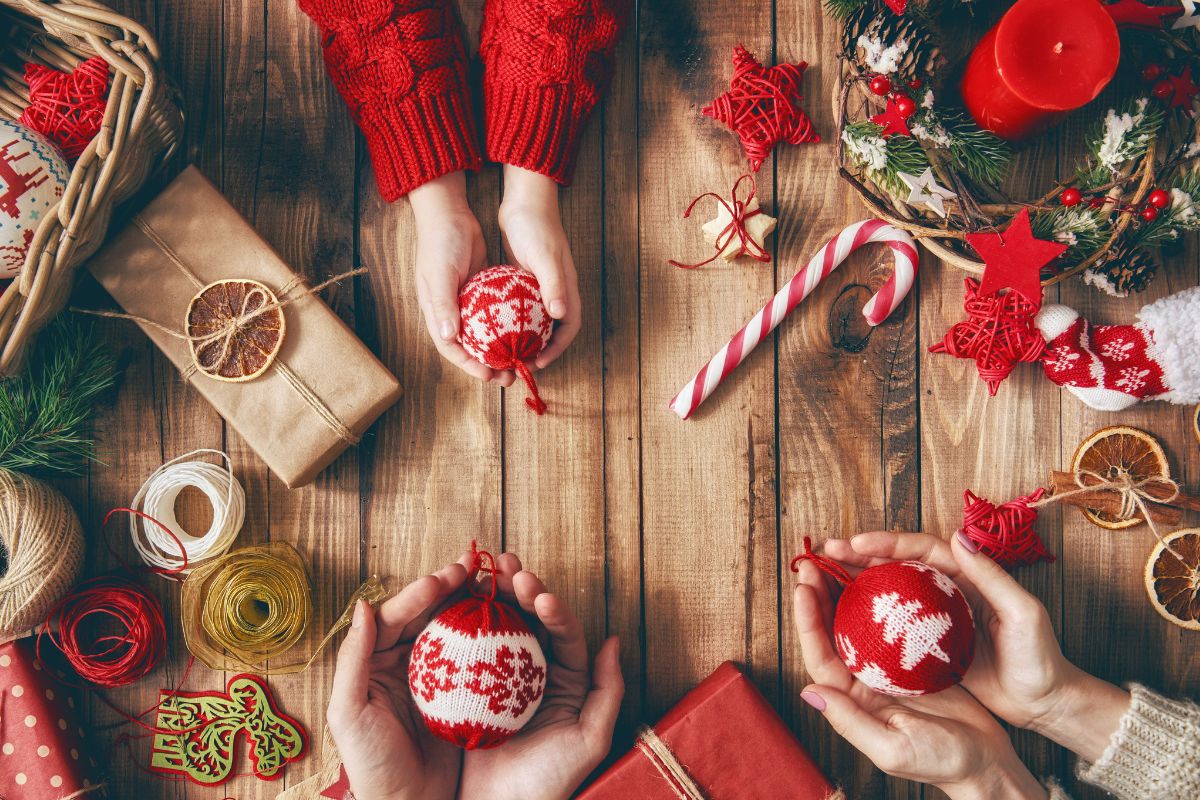 The picture shows a family making handmade ornaments.