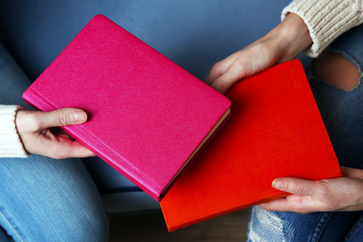 The image shows women exchanging books.