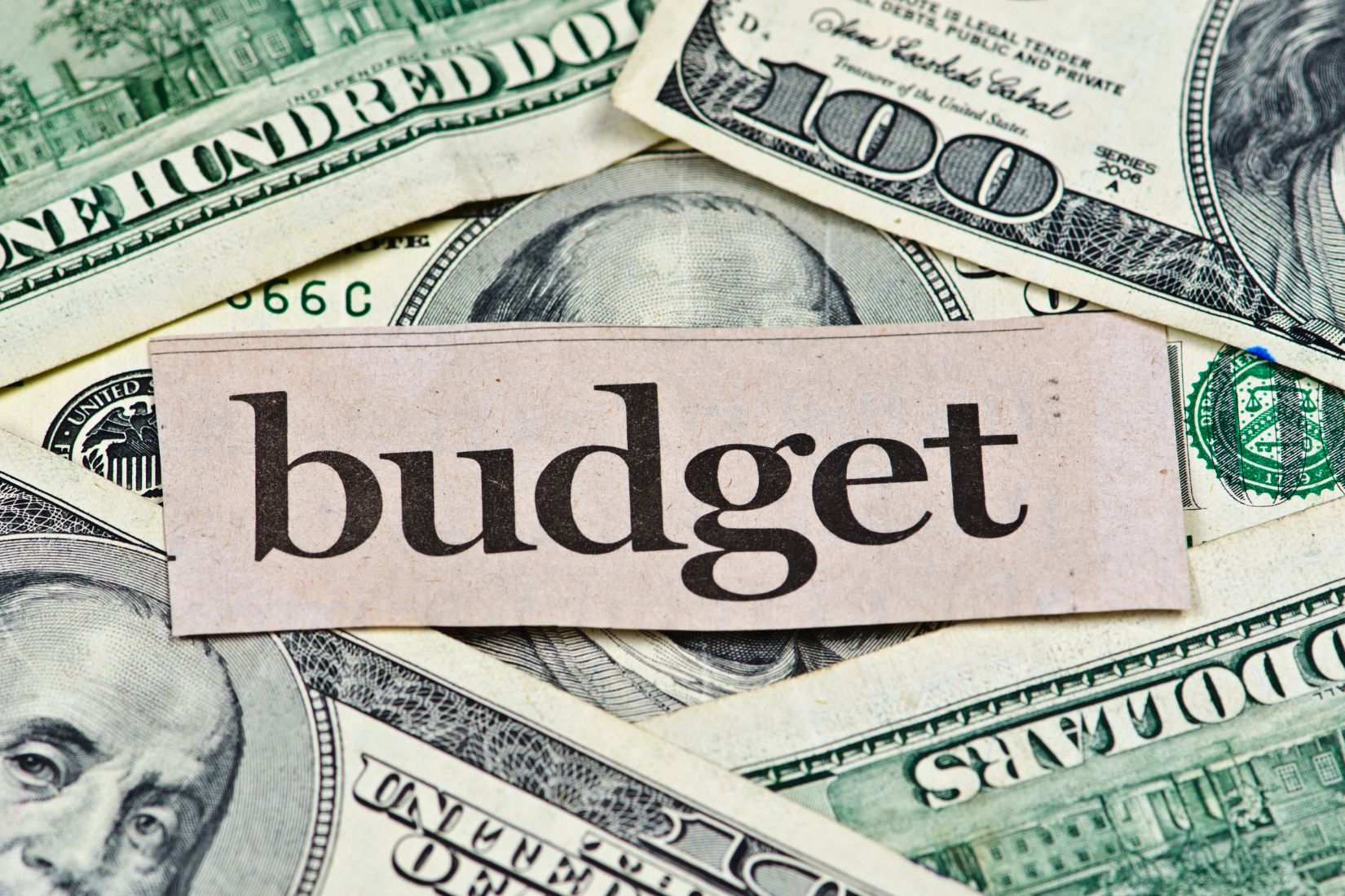 The image shows money and budget wording.