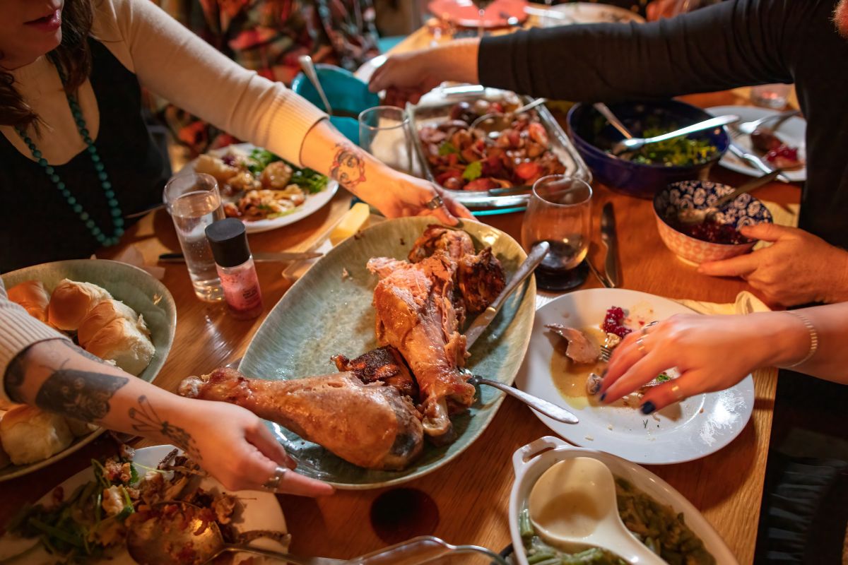 The picture shows a family eating together.