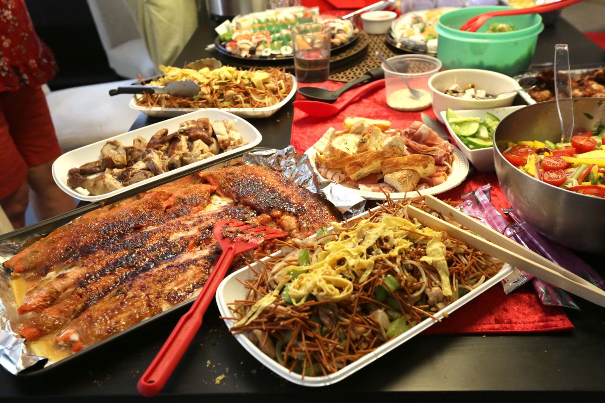 The image shows a potluck-style gathering.