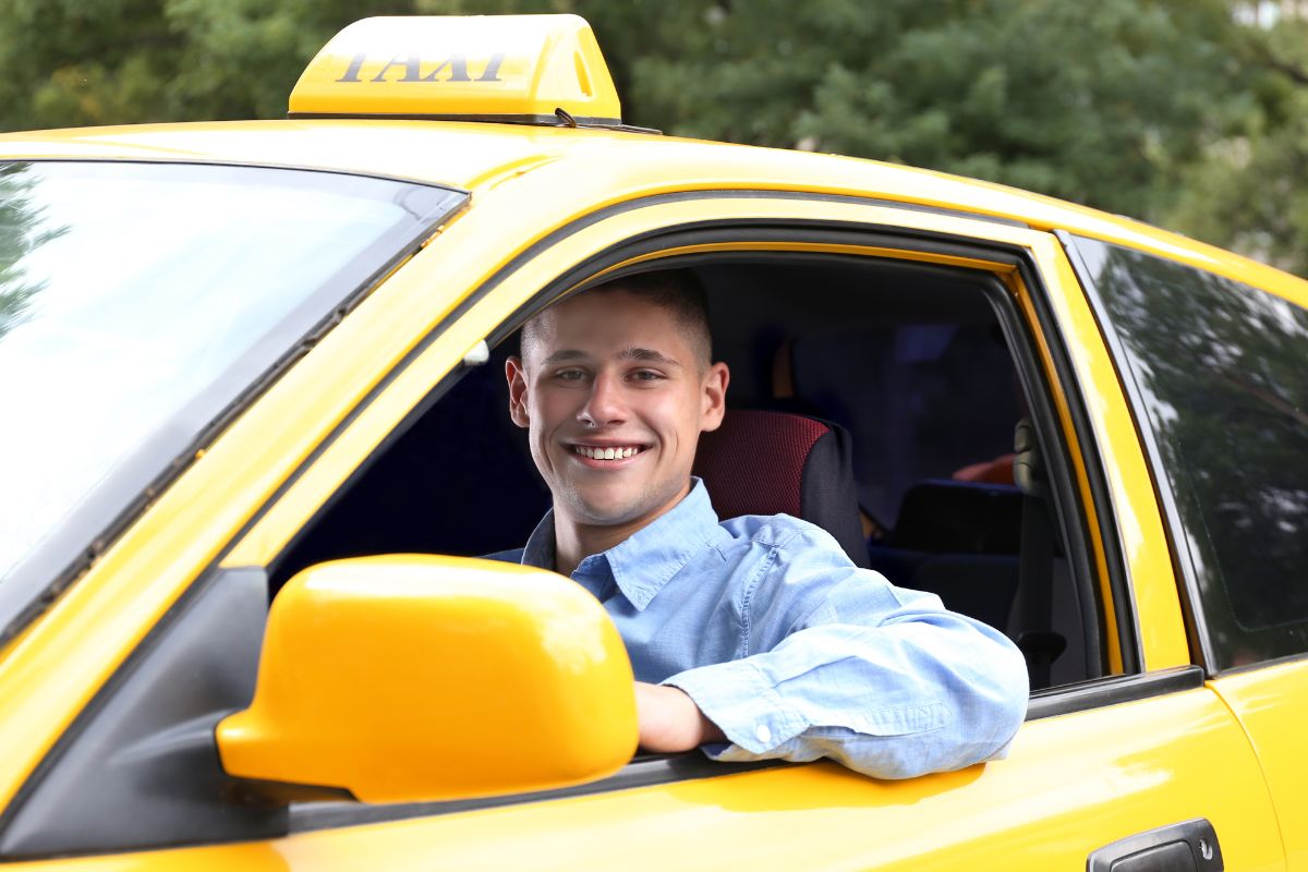 Photo of a taxi driver in a cab.