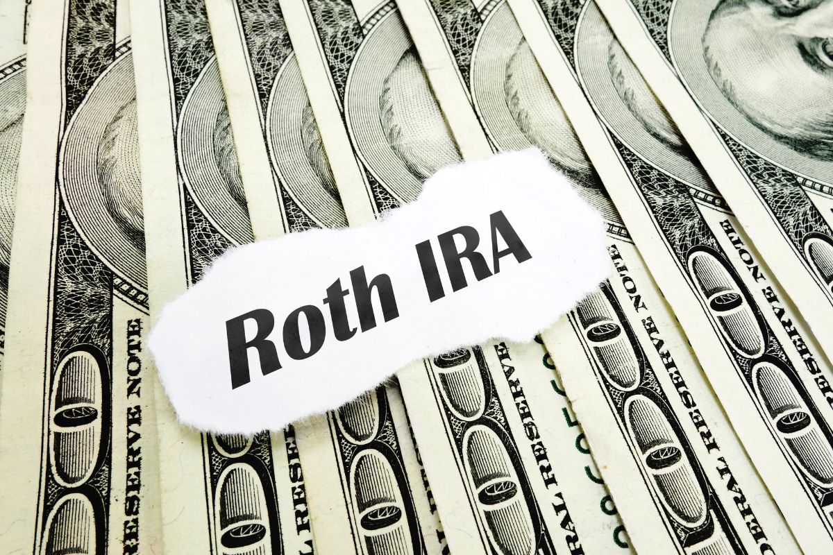 Photo of money and Roth Ira wording.