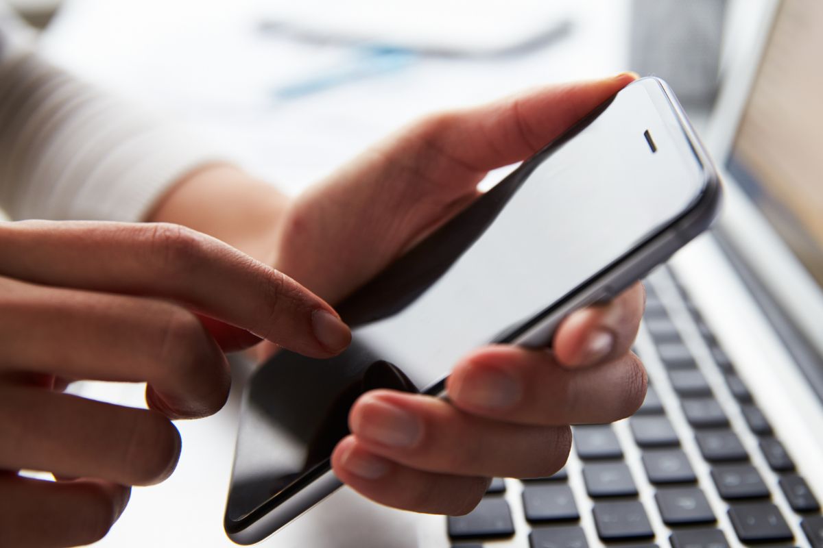  A woman's hand using a phone.