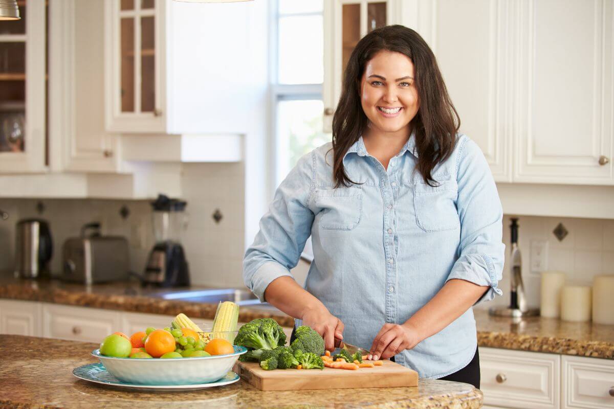 The photo of the ingredients on the bowl and a girl chopping the vegetable means to cook a special meal for someone who has helped you along the way.