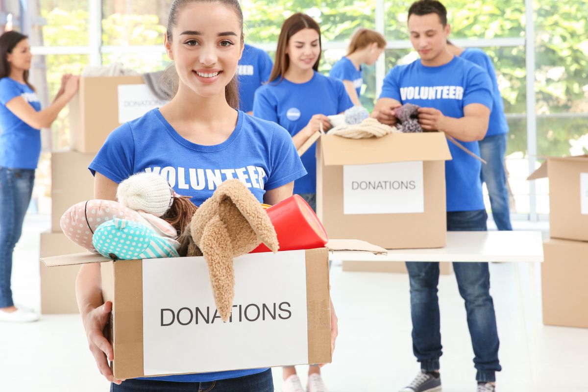 The image shows a group of people conducting a charity.