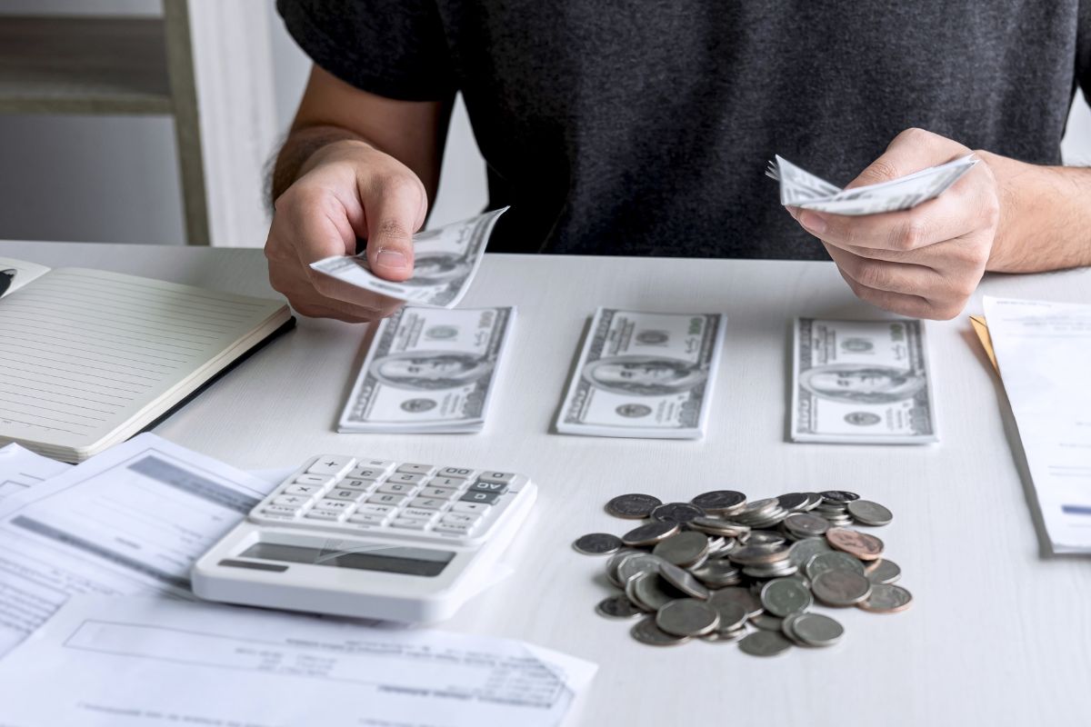 Picture of a man budgeting money.