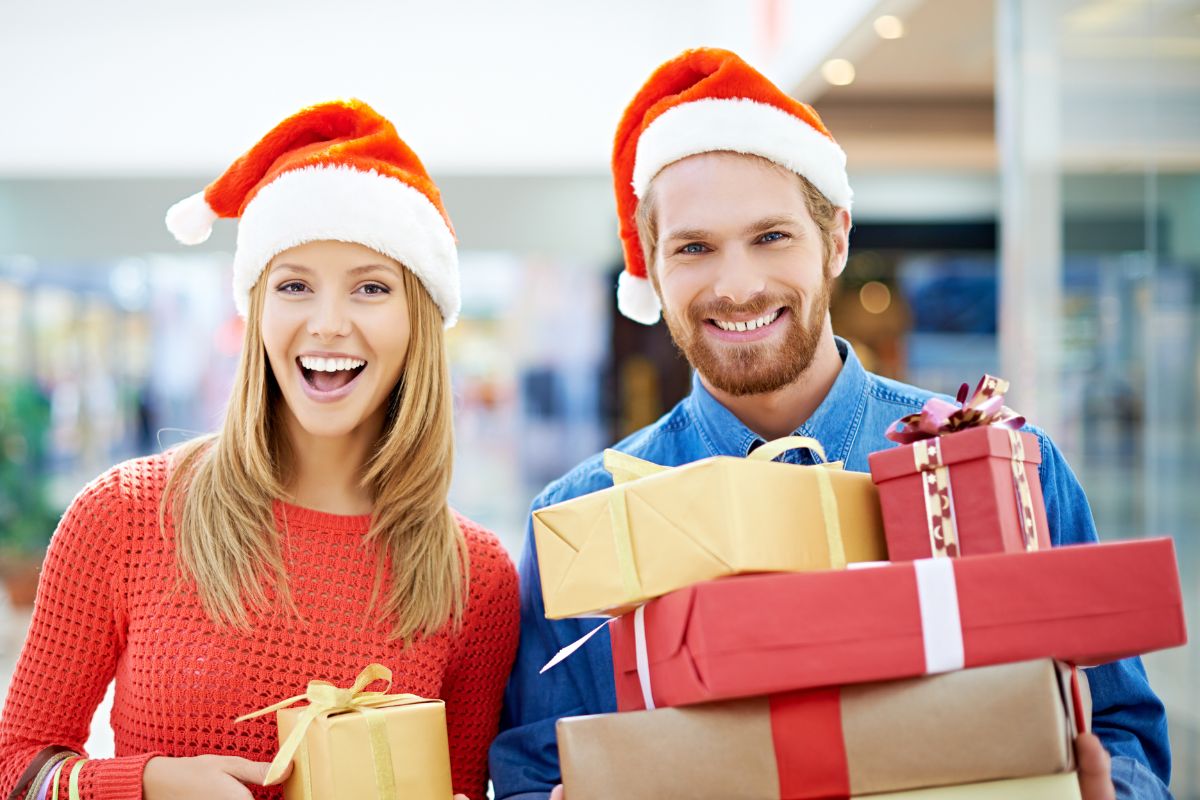 Image of a couple carrying gifts.