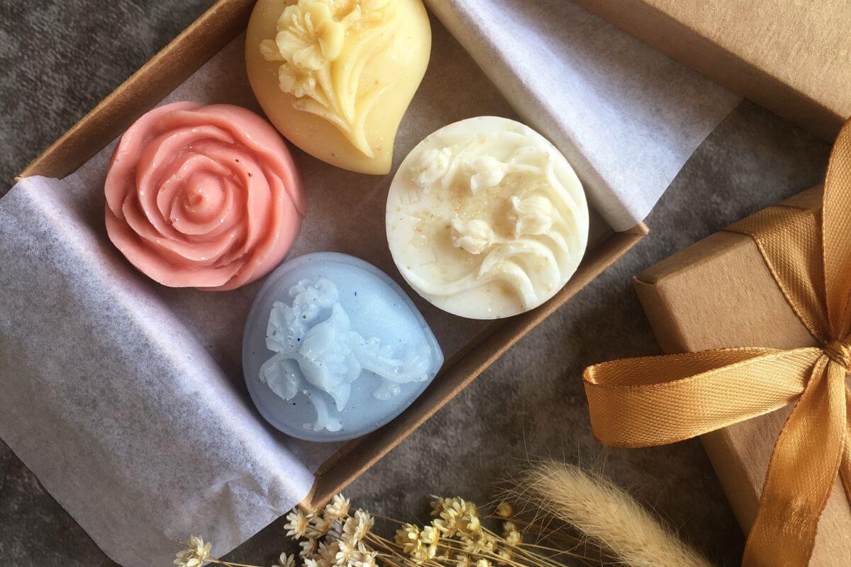 The photo of homemade soaps inside a box refers to choosing meaningful handmade gifts and giving something personal without spending a lot.