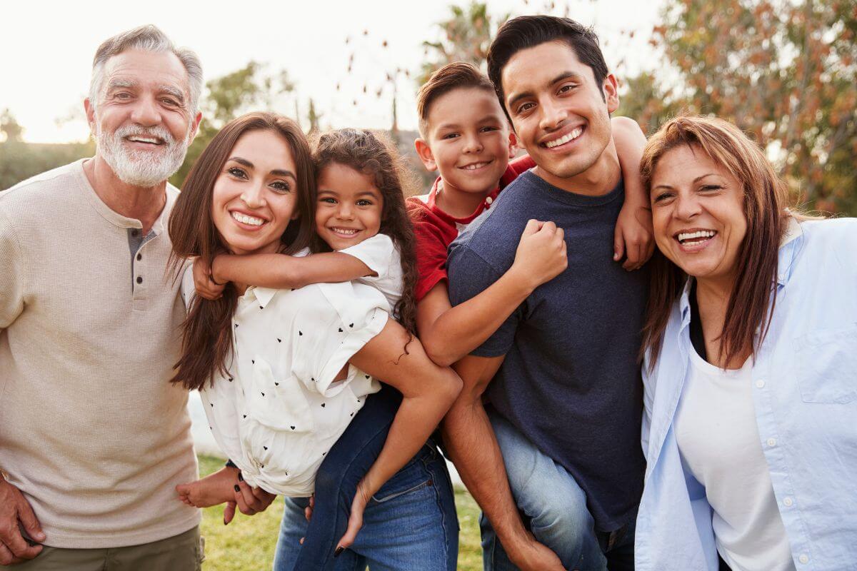 The image tells about a group of family together which means to give experiences instead of physical gifts to make memories while avoiding the pressure to buy expensive items.