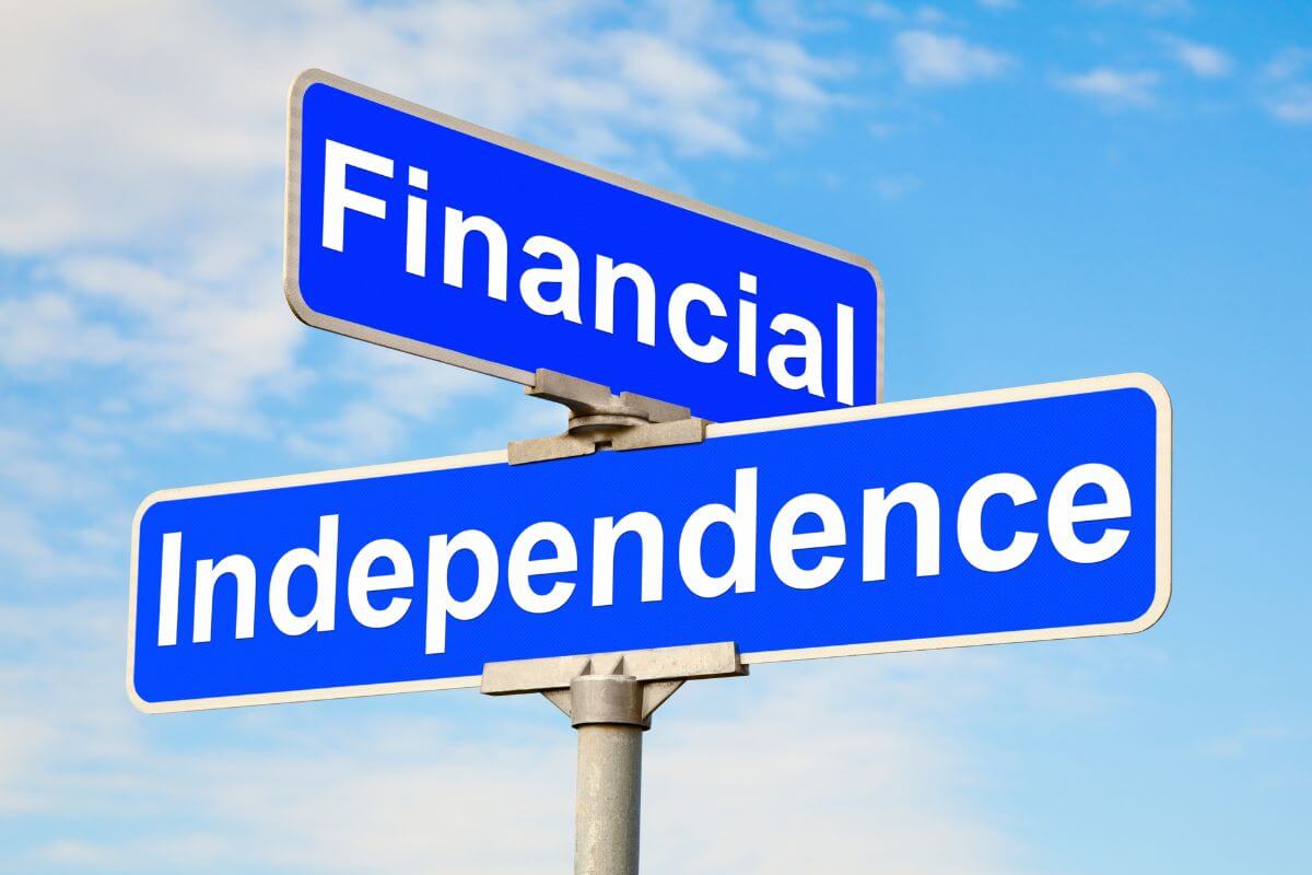 The picture tells about the street sign with notes on it referring to recognizing that financial independence is a process, not an instant result that takes time and effort.