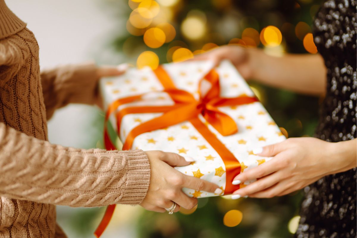 Image of women exchanging gifts.