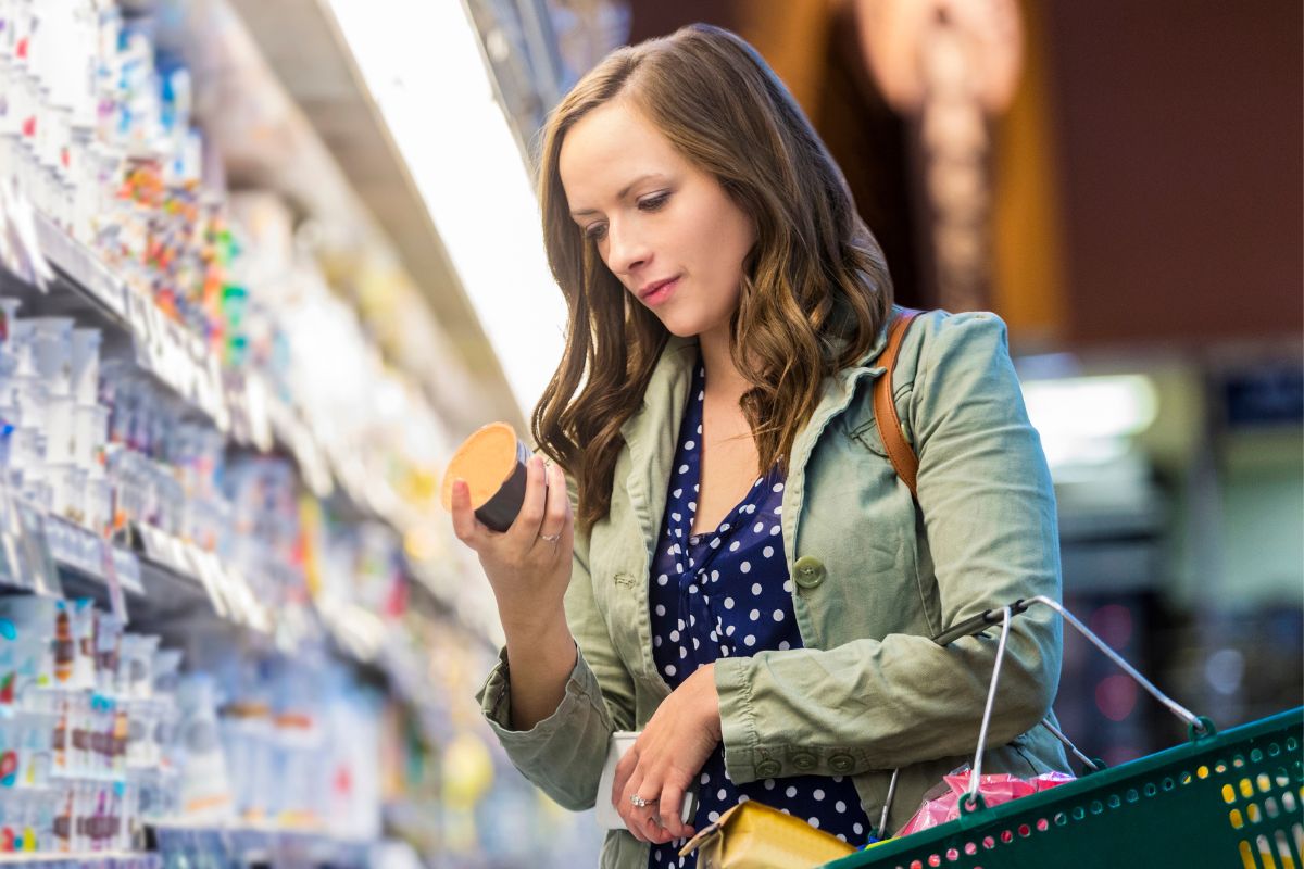 A woman buying groceries at a store.