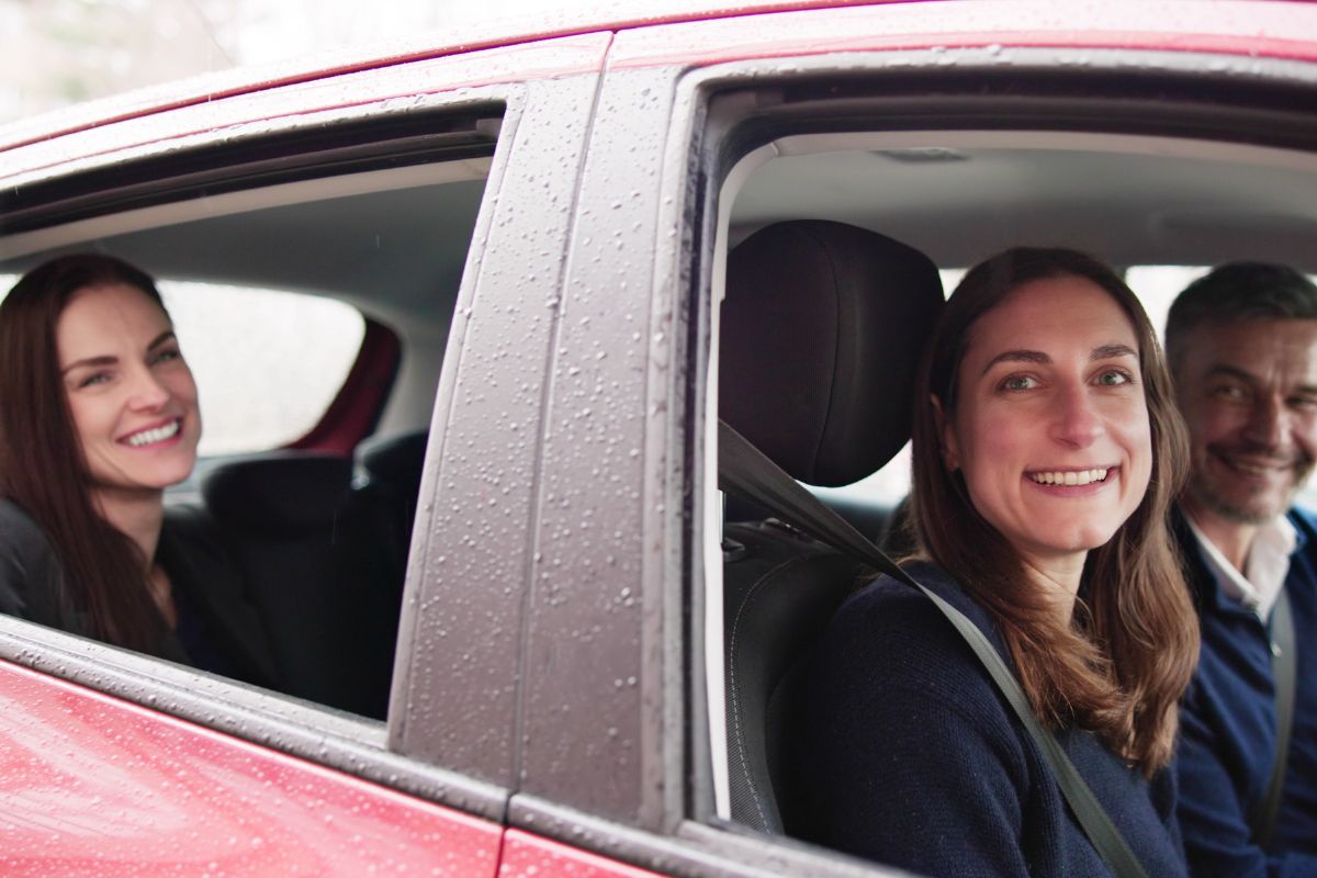 The image shows passengers and a driver.