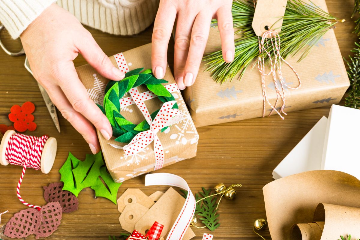 A woman's hand is making a homemade gift.