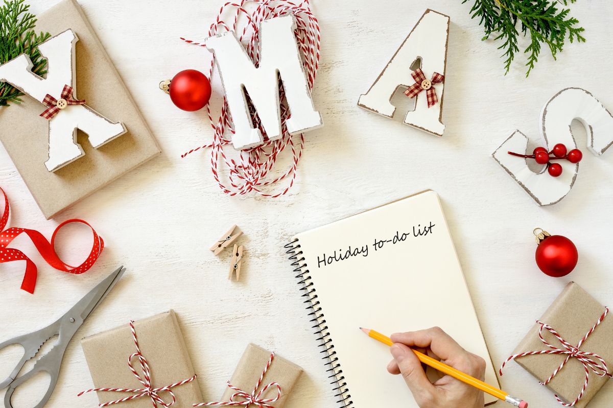 A man's hand planning the holiday.