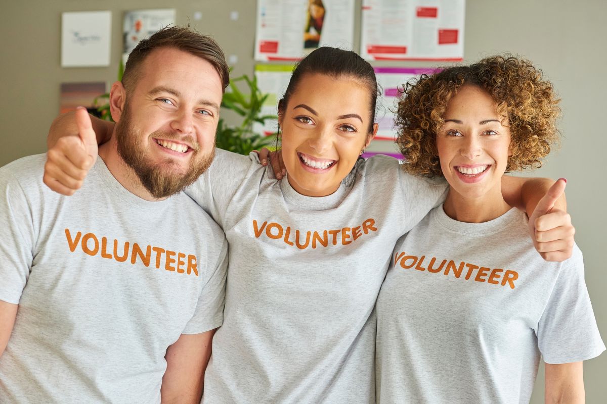 The image shows a group of volunteers.