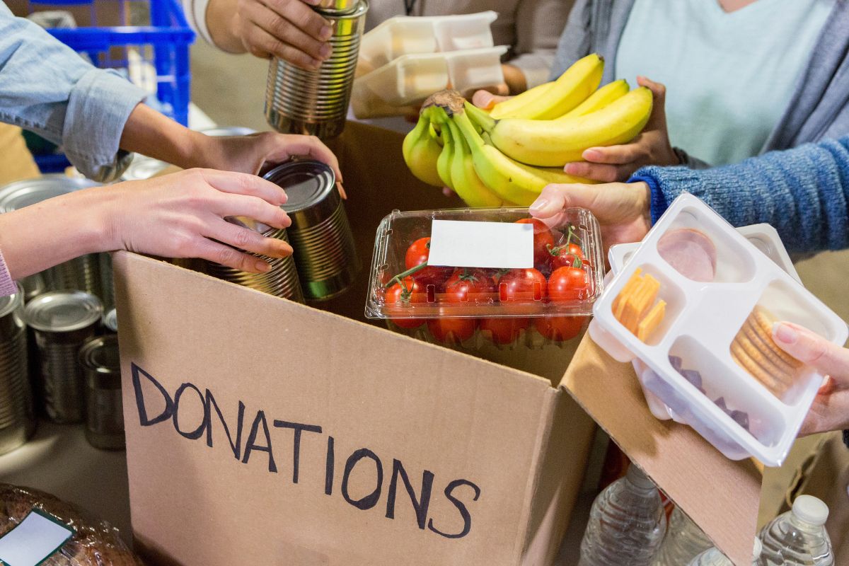 The photo shows a group of people donating.