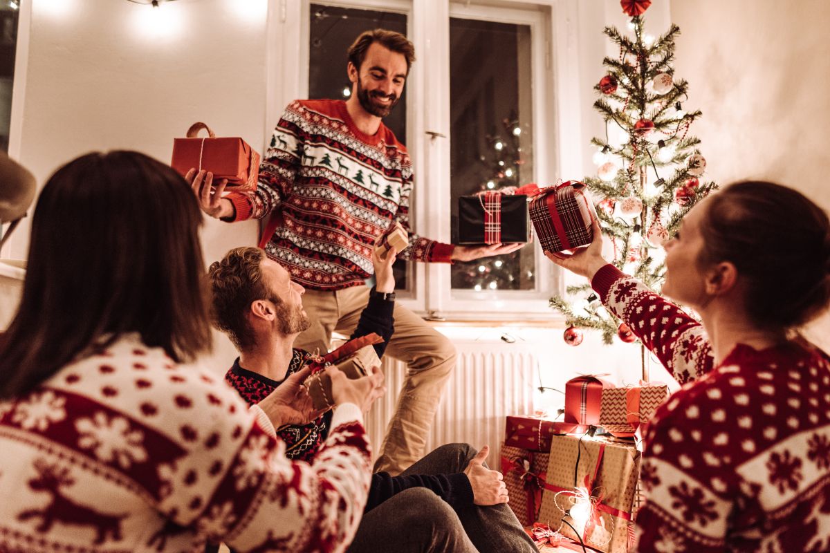 The picture shows a group of people exchanging gifts.