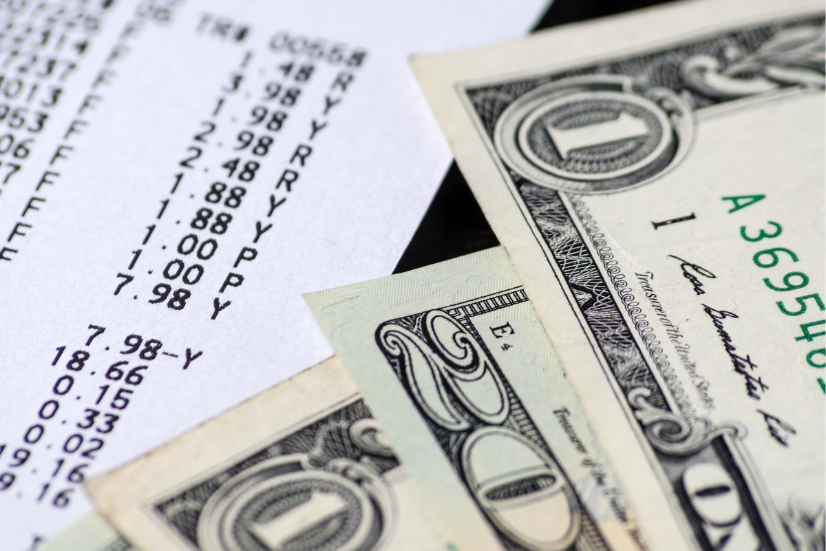 Picture of a receipt and money.