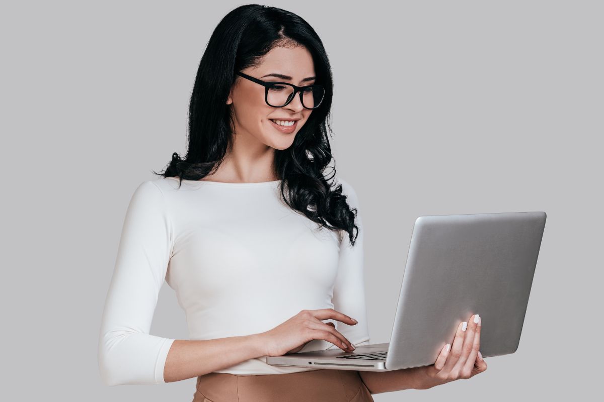 A woman using a laptop.